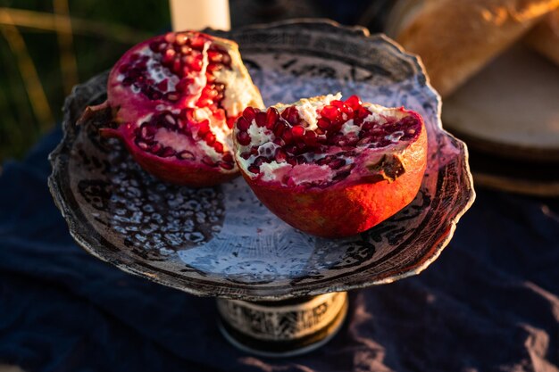 Halved pomegranate on a beautiful plate