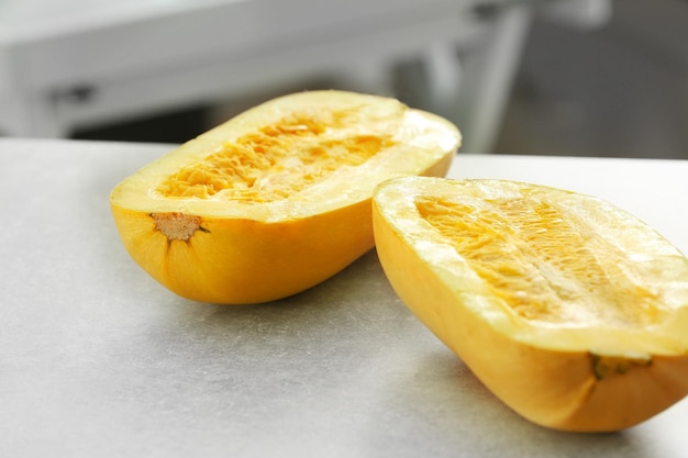 Halves of fresh spaghetti squash on table