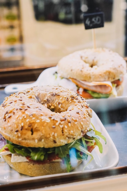 Ham bagel with lettuce and tomato