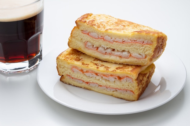 Ham crab sandwich and coffee on white background