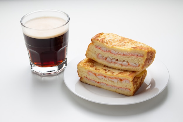 Ham crab sandwich and coffee on white background