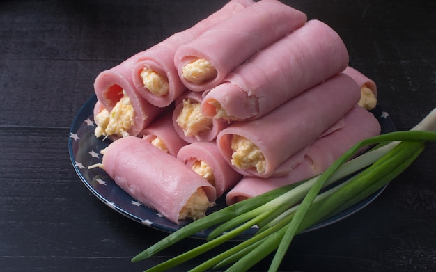 Ham roll with cheese and garlic. Cold appetizer