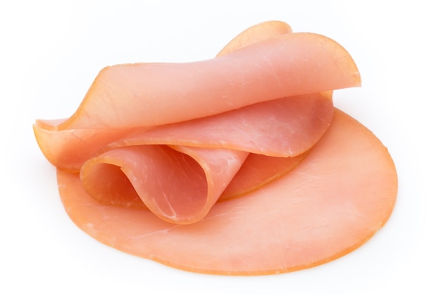 Foto salsiccia affettata prosciutto isolato su priorità bassa bianca.