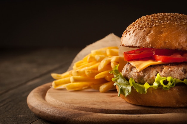 Hamburger with beef, onion, tomato, lettuce and cheese. 