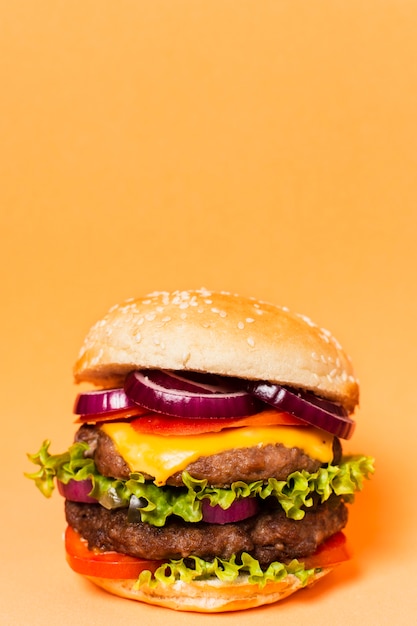 Photo hamburger with copy space on yellow background