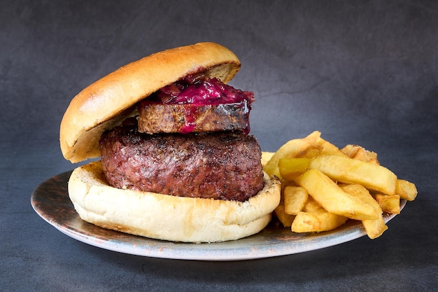 hamburger with french fries on chalkboard background