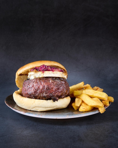 hamburger with french fries on chalkboard background