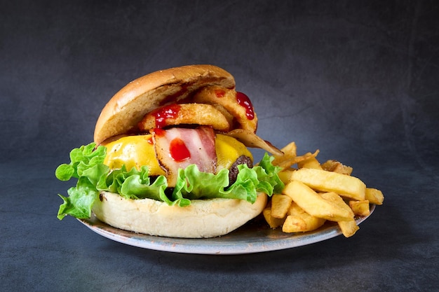 hamburger with french fries on chalkboard background