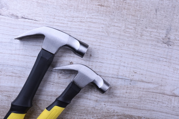 Hammer iron on wooden table