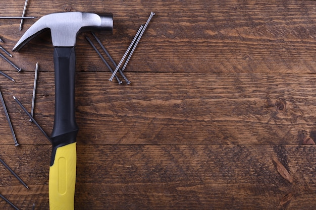 Hammer iron on wooden table