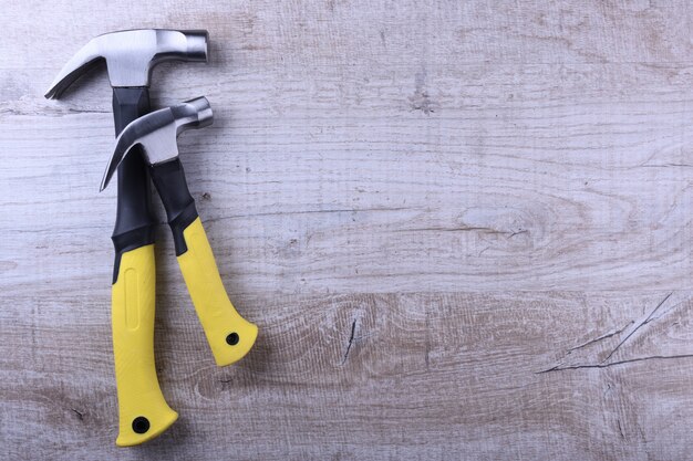 Hammer iron on wooden table