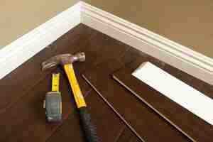 Photo hammer laminate flooring and new baseboard molding abstract