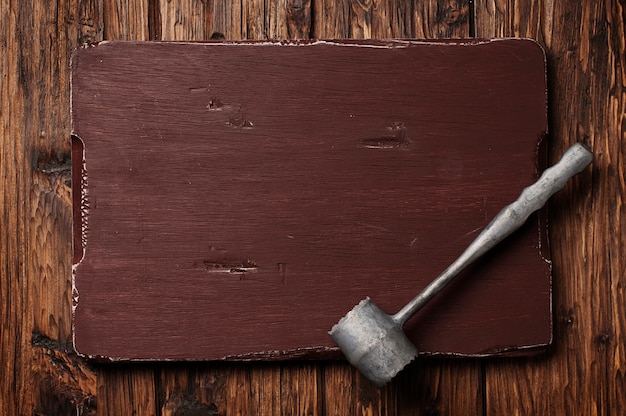 Hammer for meat on the vintage board