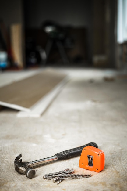 Hammer Nails and Orange Measuring tape