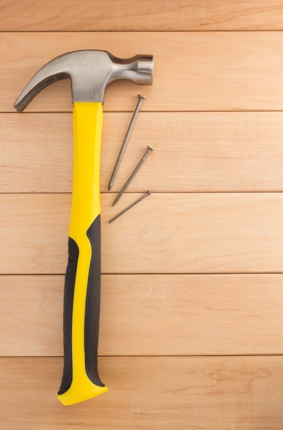 Hammer tool on wooden wall