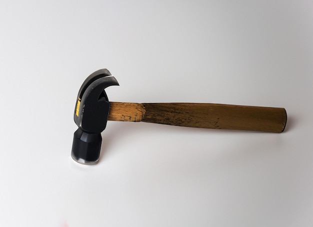 Hammer on white surface