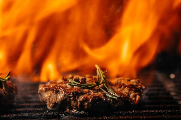 Hamuburgers cooking on grill. lamb burgers spiced by mint and lamb rub on bbq grill