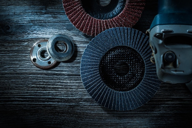 Hand angle grinder radial sanding discs on vintage wooden board