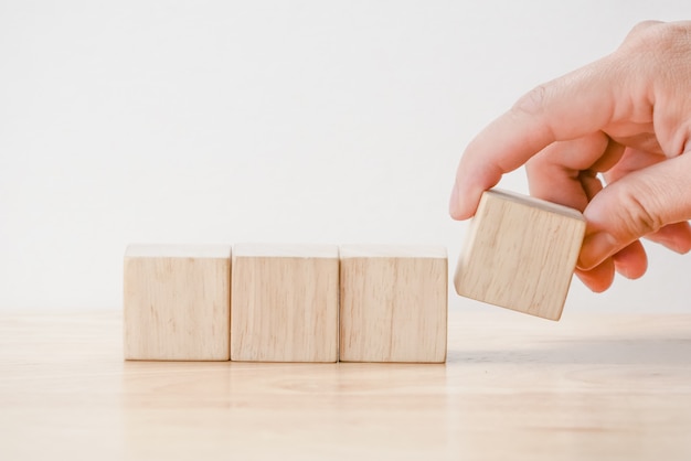 Hand arranging wood block