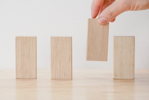 Hand arranging wood block