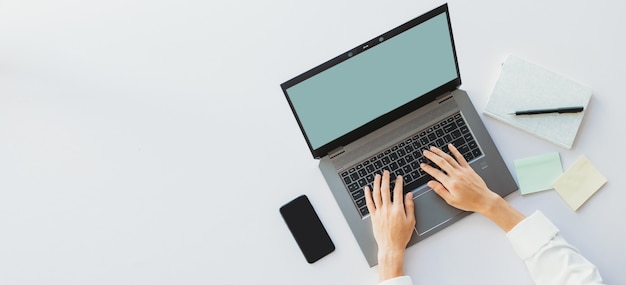 Photo hand of asian business woman using laptop to typing, top view