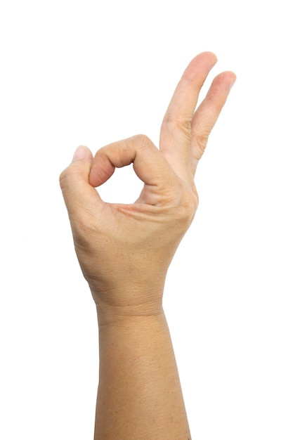 Hand of Asian woman is show OK gesture isolated on white