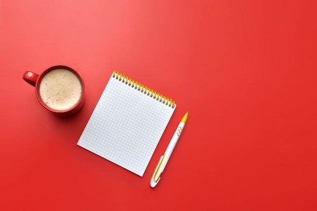 Hand, block, cup of coffee on a chair. composition plan of newый year