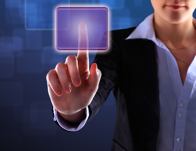 Photo hand of business women pushing a button on a touch screen interface