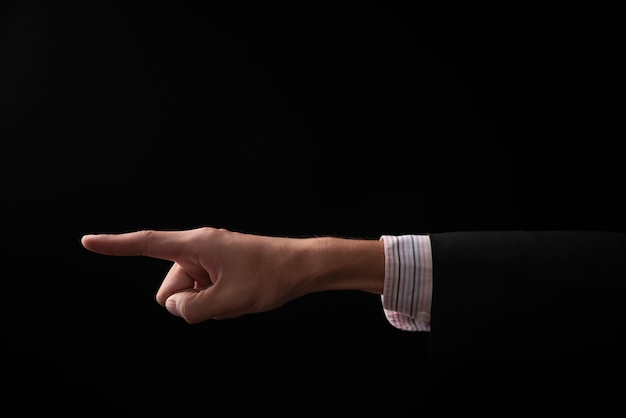 Hand of businessman emotion on black background