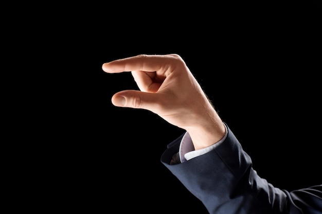 hand of businessman holding something imaginary