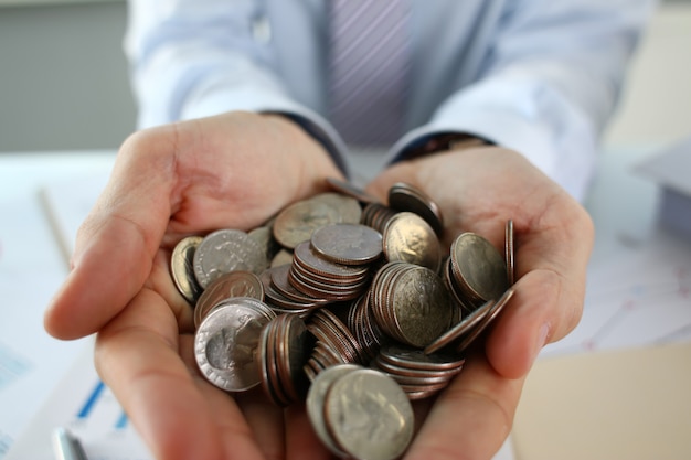 Hand businessman putting pin money