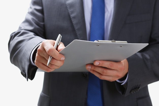 Hand of businessman in suit filling and