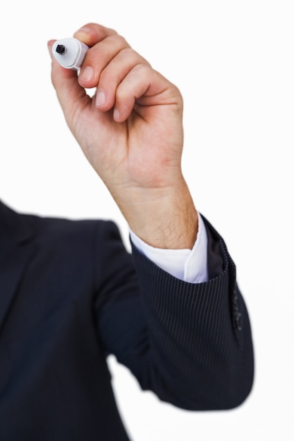 Hand of a businessman writing with marker