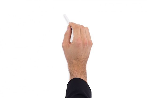 Photo hand of a businessman writing with a white chalk
