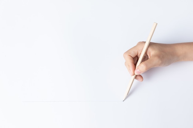 Photo hand of businesswoman writing on paper in the office
