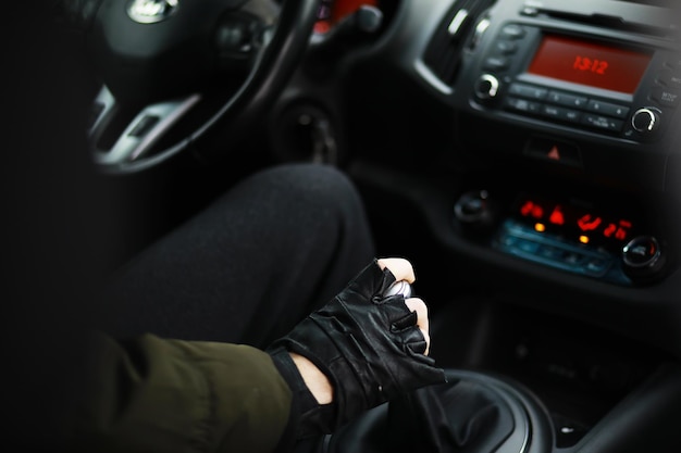 Hand on the car gear knob The driver switches the speed in the car Hand on gear lever