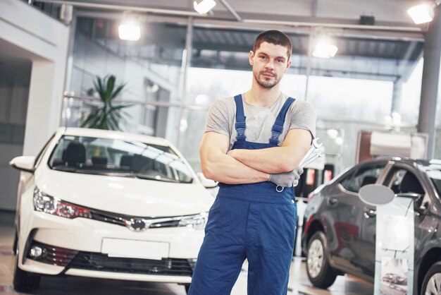 Photo hand of car mechanic with wrench auto repair garage