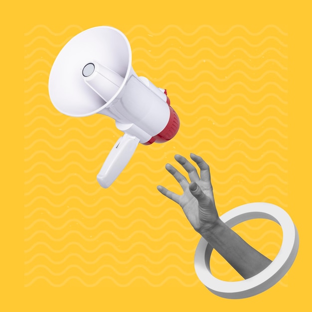 Hand catching a flying loudspeaker on a creative abstract yellow background