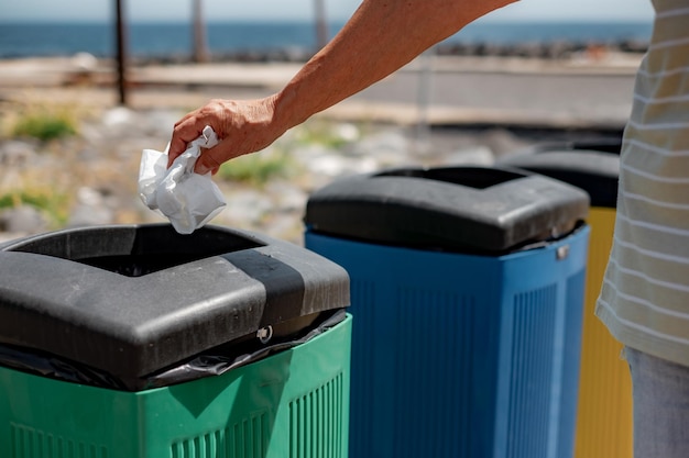 Hand of Caucasian People Throwing Away Waste in Recycle Containers Differentiated Collection Concept