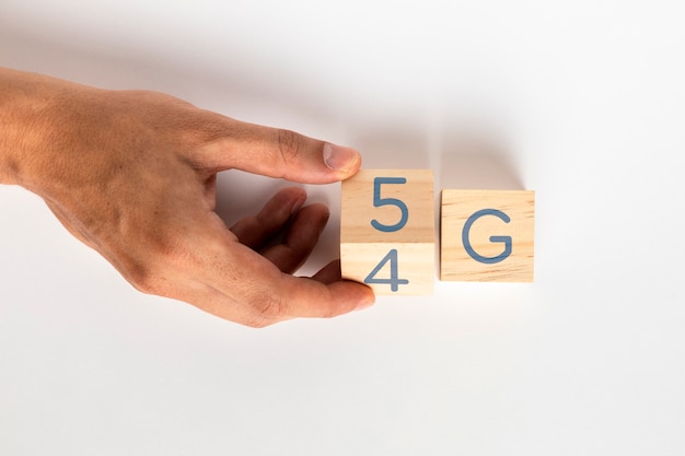 Hand changing 4g to 5g on cubes