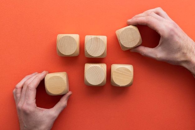 Hand choosing a wooden block from a set Business choice concept