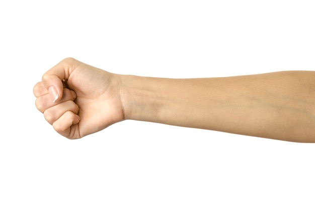 Hand clenched in a fist. Horizontal image. Woman hand with french manicure gesturing isolated on white background. Part of series