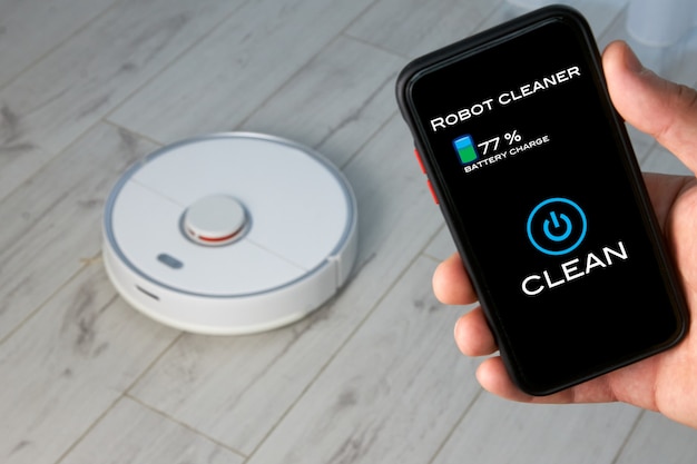 Hand control of the robot vacuum cleaner in the app on the mobile phone screen