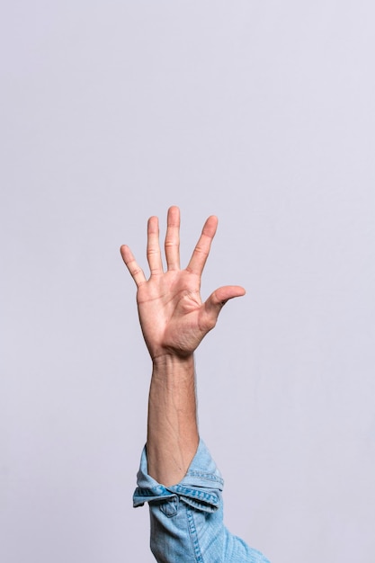 Hand counting number five Man hand showing number five Guy finger counting number five on isolated background