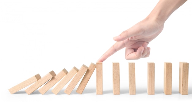 Hand die het Domino-effect stopt, gestopt door uniek