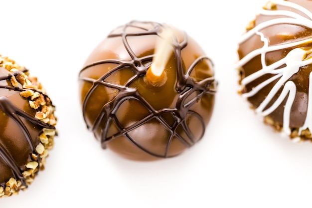 Hand dipped caramel apples decorated for Halloween.