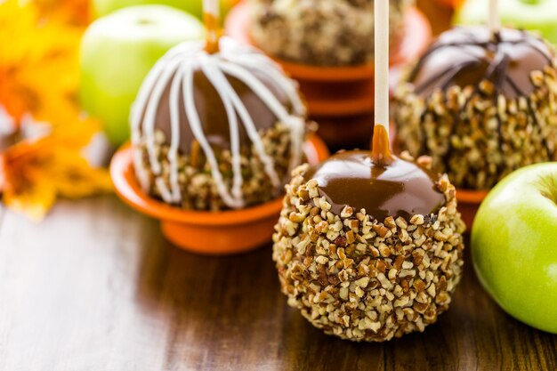 Hand dipped caramel apples decorated for Halloween.