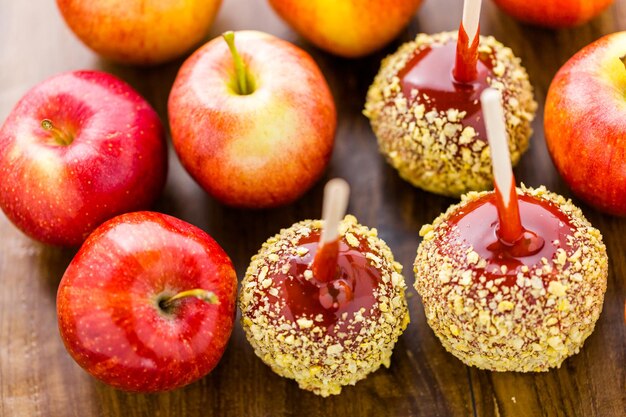 Photo hand dipped caramel apples decorated for halloween.