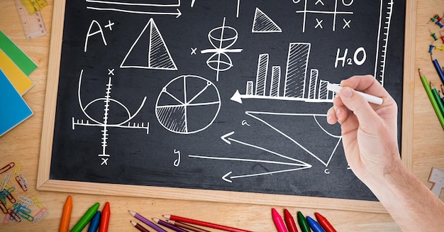 hand drawing diagrams on blackboard