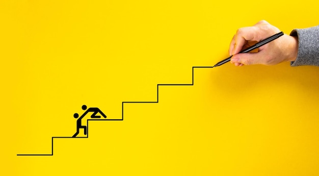 Hand drawing staircase on yellow background team work for success